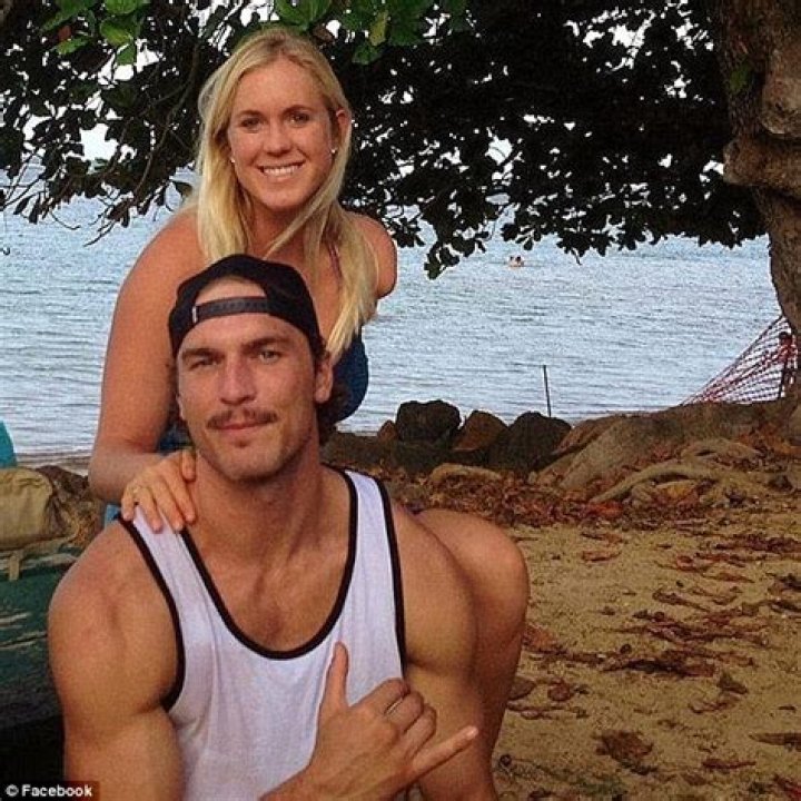 Bethany Hamilton beams as she's lifted into the air by new husband Adam