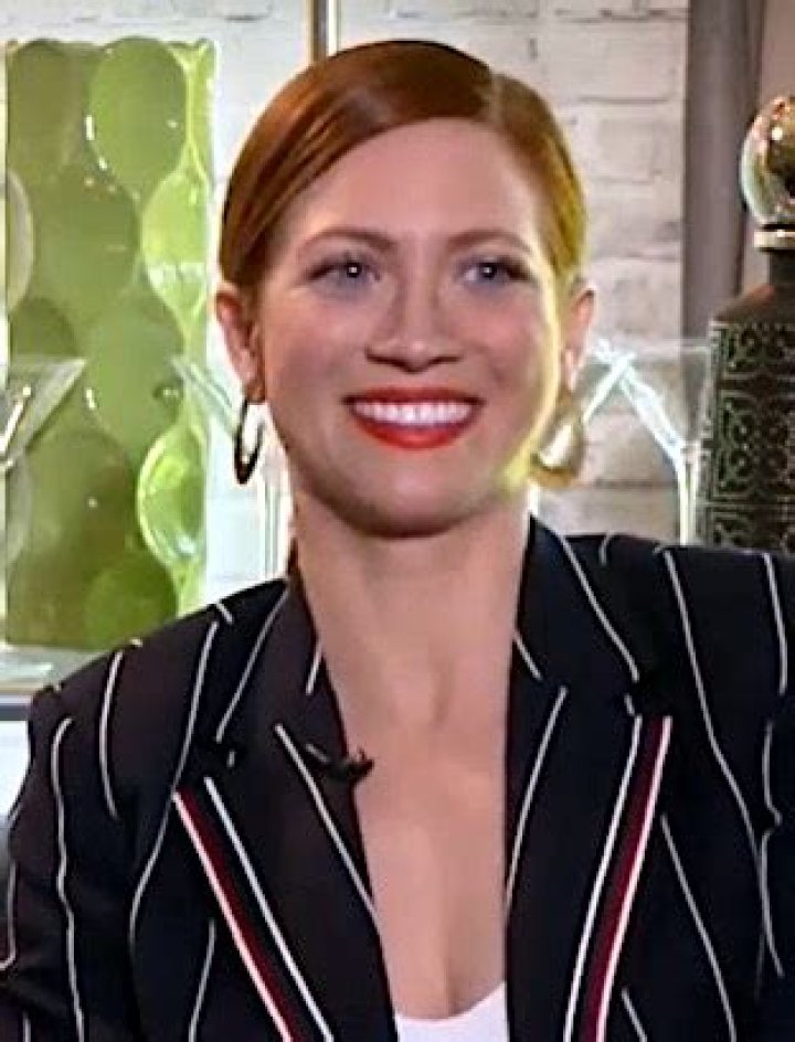 Brittany Snow in a Green Track Jacket Out with Husband Tyler Stanaland