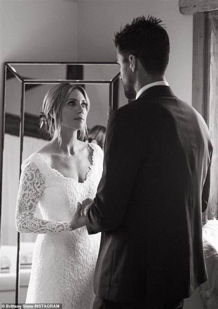 Brittany Snow looks radiant in white while posing with fiancee Tyler