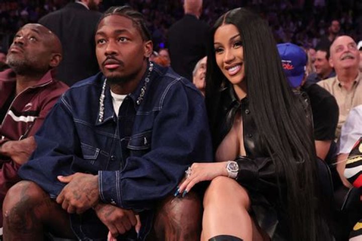 Cardi B shows her growing baby bump in a tee and leggings while out
