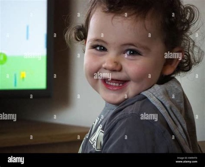 cheeky boy with cheeky smile Stock Photo Alamy