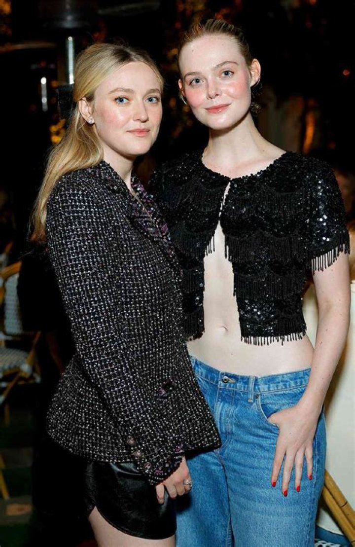 Dakota Fanning keeps a firm grip on her new man as she pulls him out of