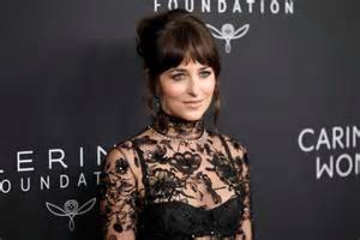 Dakota Johnson dons racy black corset to cosy up to Paul Mescal at The