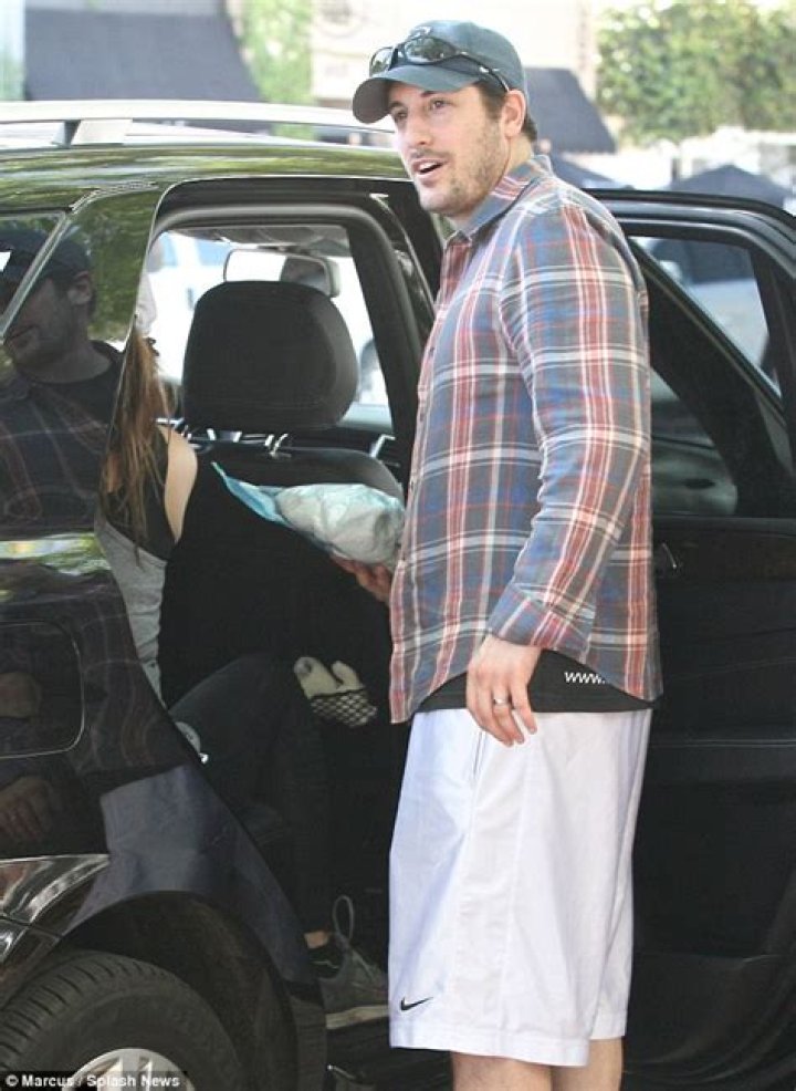Doting father Jason Biggs and wife Jenny Mollen take newborn son Sid on