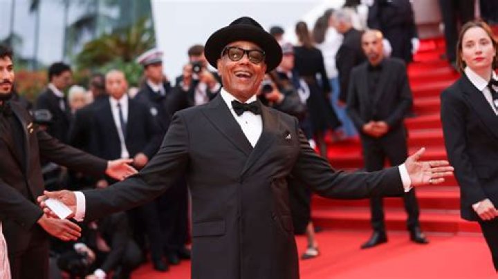 Giancarlo Esposito looks dapper in a black suit and top hat as turns