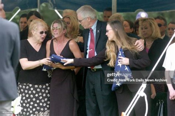 Heather Duggan is comforted by her mother and Daniel and Maureen