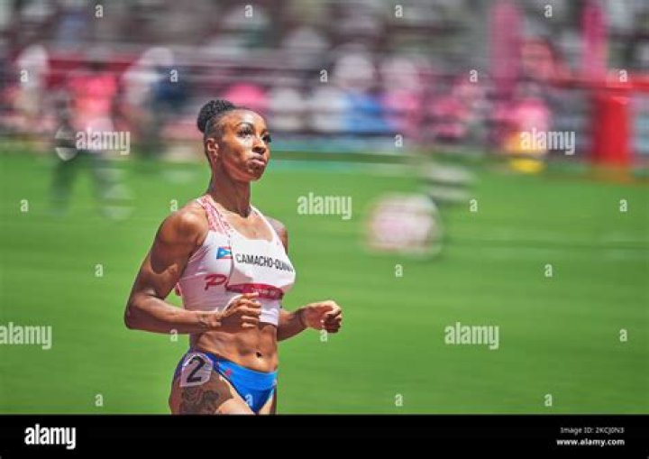 Jasmine CamachoQuinn records upset in 100meter hurdles, securing gold