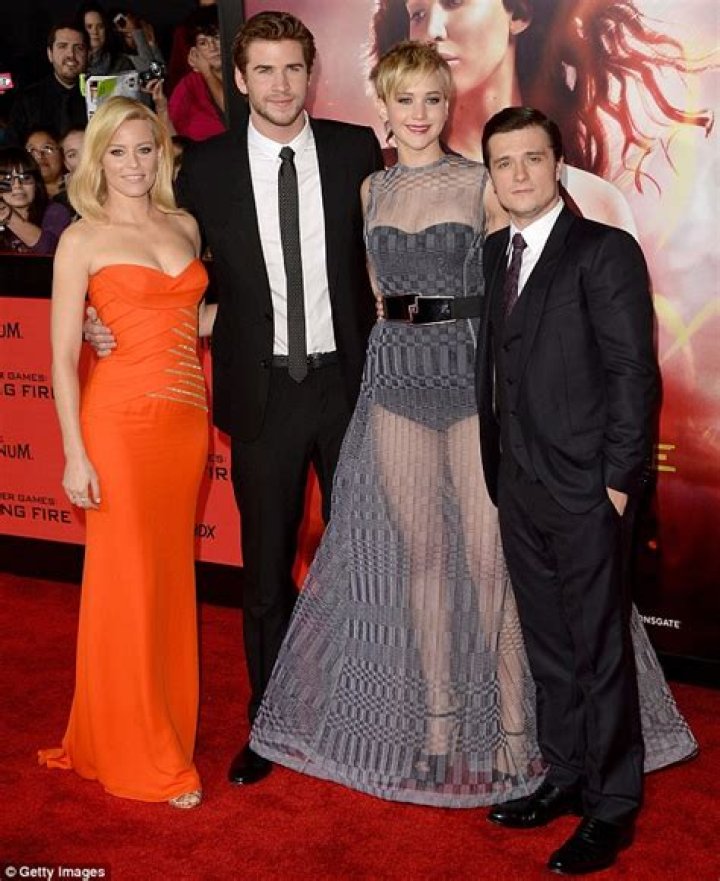 Jennifer Lawrence towers above Josh Hutcherson at LA premiere as film