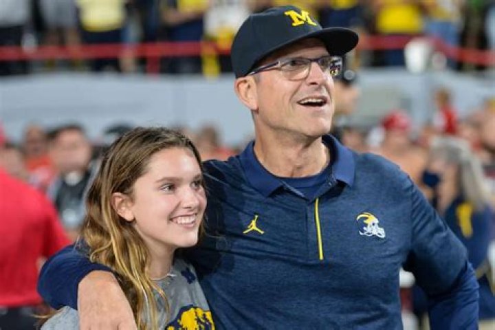 Jim Harbaugh coaches his kids on how to hustle and win Halloween