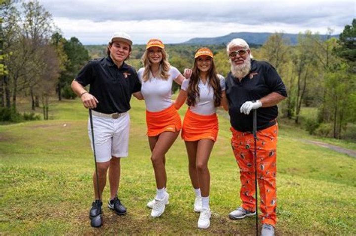 John Daly, rocking Arkansas shorts, hits golf ball over highway, onto