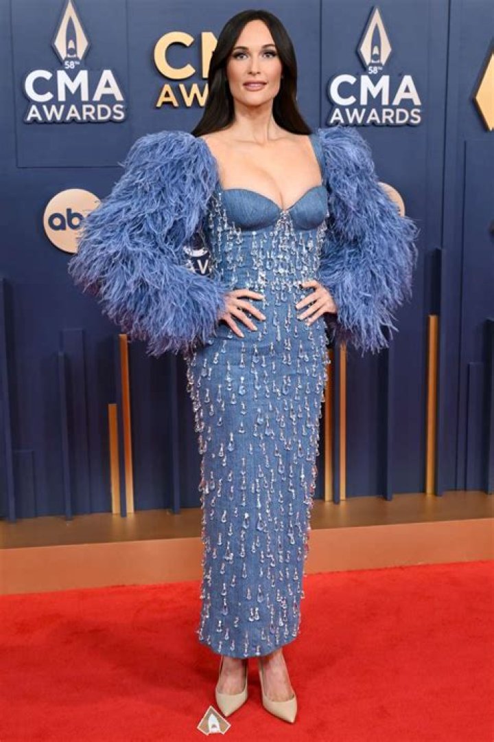 Kacey Musgraves Is Pretty in Pink With Bodysuit and Feathered Cape at