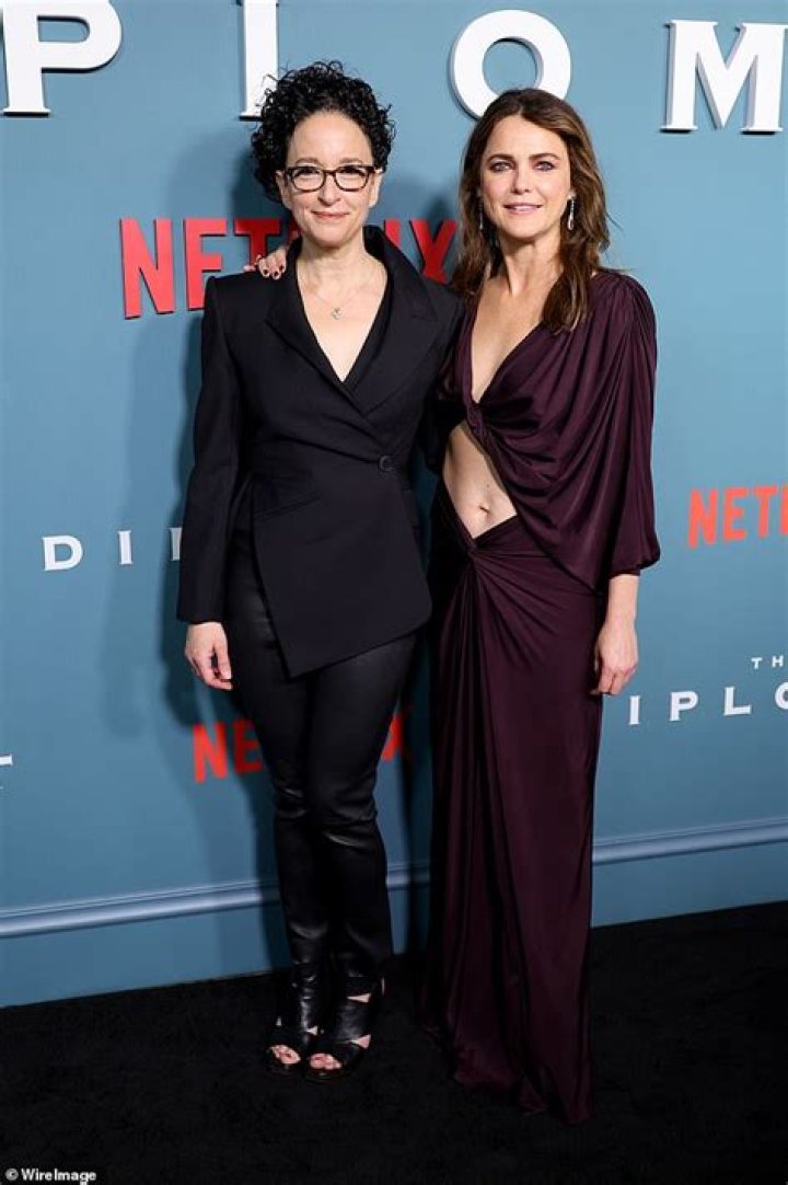 Keri Russell stays close to her husband Matthew Rhys as they attend the