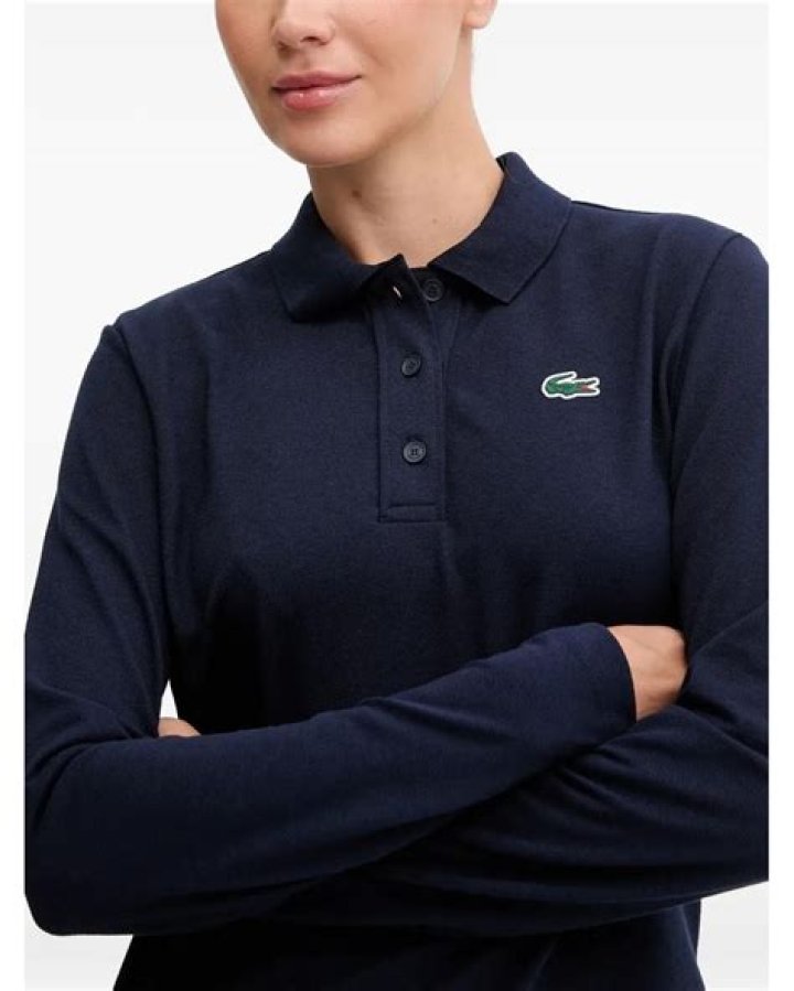 Lacoste Blue Long Sleeved Polo Shirt Worn By Actor Damson Idris As