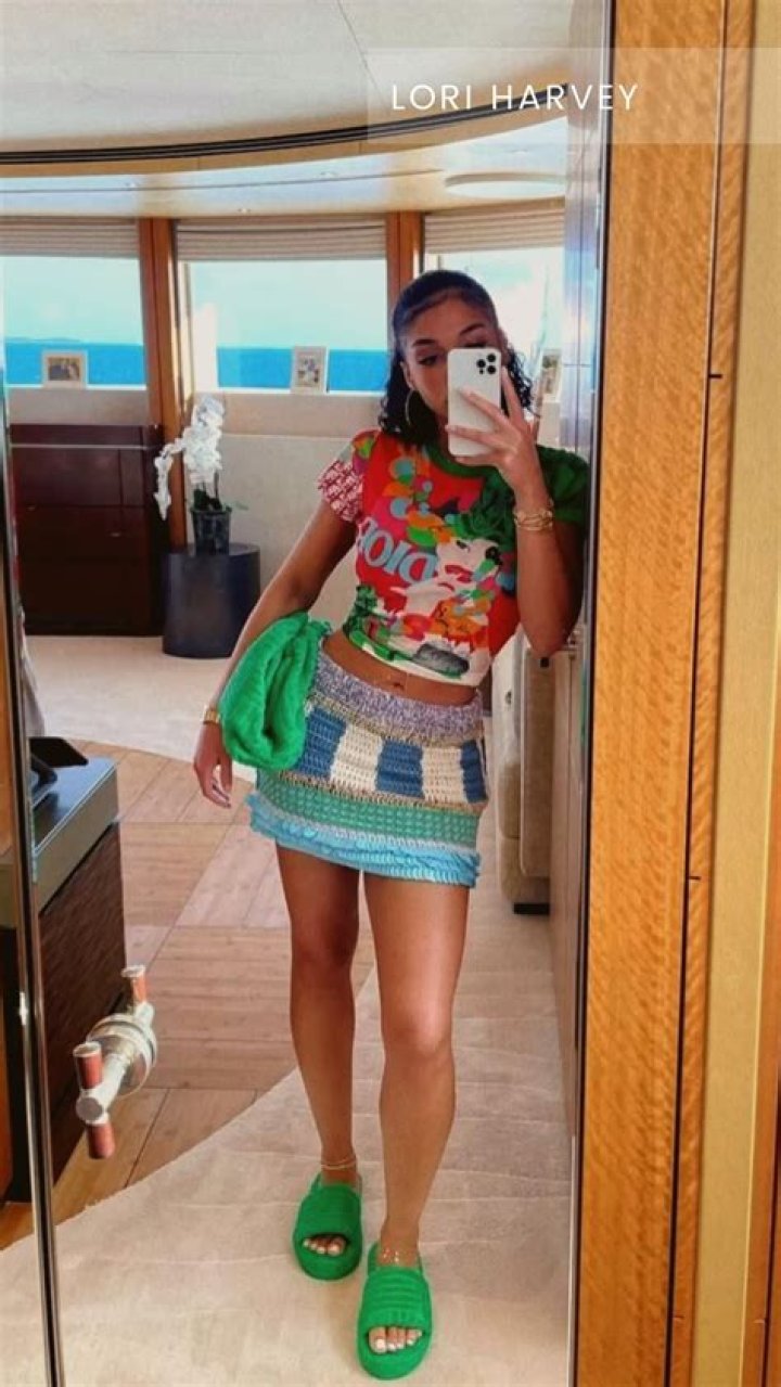 Lori Harvey Vacations in the Bahamas in Vintage Chanel Swim Top, Jean