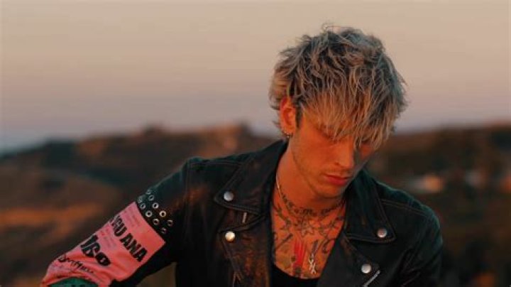 Machine Gun Kelly rocks mask for fashion show with daughter