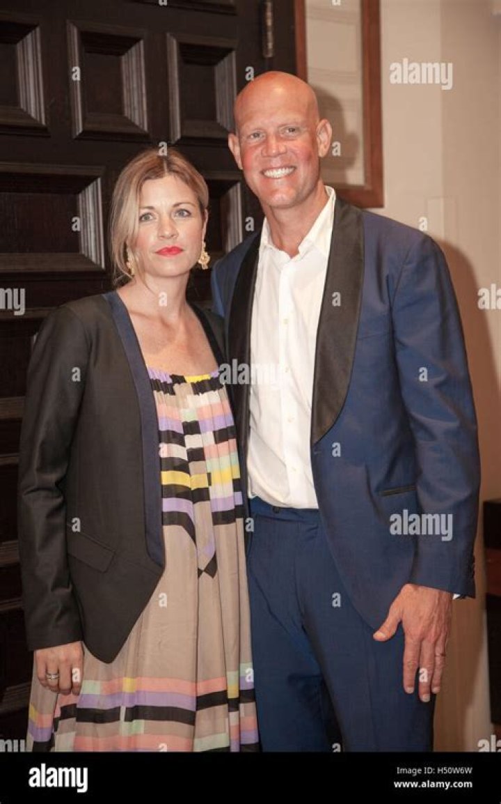 Murphy Jensen and spouse pose on the Red Carpet for photos on November