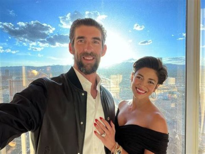 Nicole Johnson Celebrates Michael Phelps' Final Swim with Baby Boomer