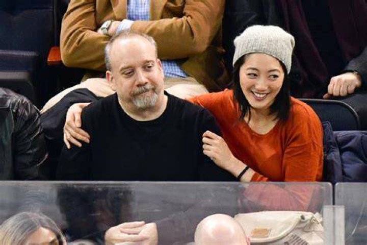 Paul Giamatti and mystery woman attend Rangers game