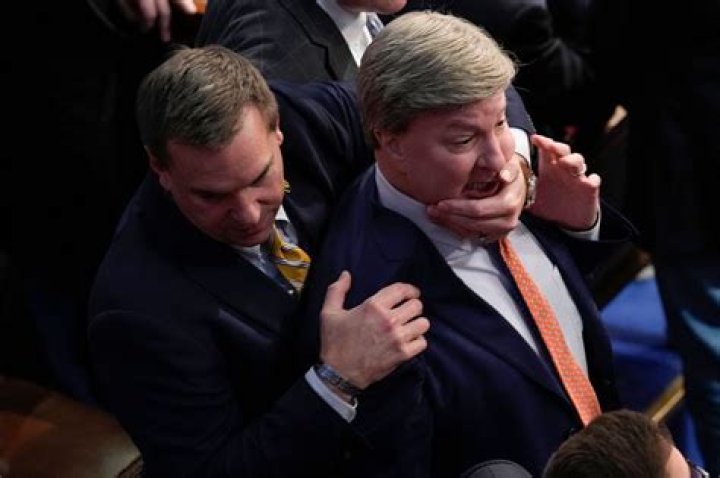 Rep. Mike Rogers jumps towards Rep. Matt Gaetz on House floor after