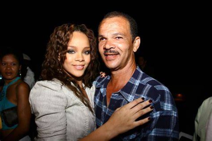 Rihanna with her father Ronald at her grandfather's birthday party in
