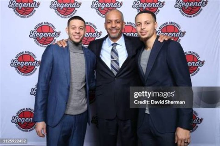 Seth Curry Dell Curry and Stephen Curry and family pose for a portrait