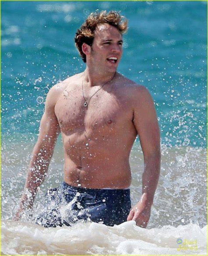 Shirtless Sam Claflin Frolics on Hawaiian Beach with Wife Laura Haddock