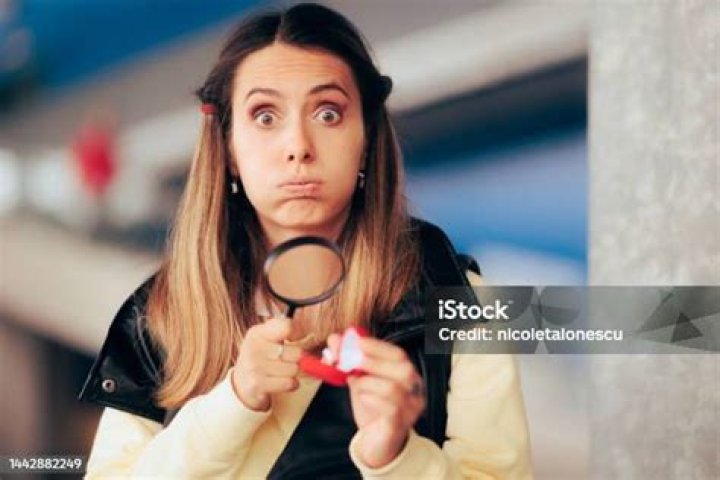 Unhappy Girlfriend Disappointed by Her Engagement Ring Stock Photo