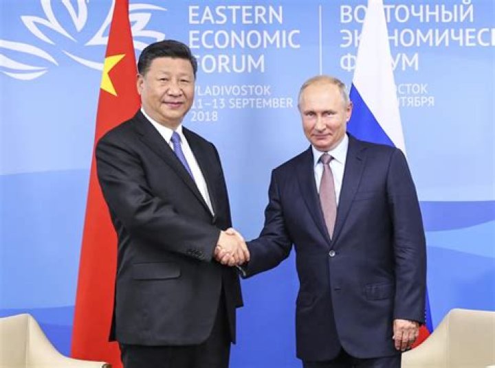 Xi, Putin vow to promote ties regardless of global changes
